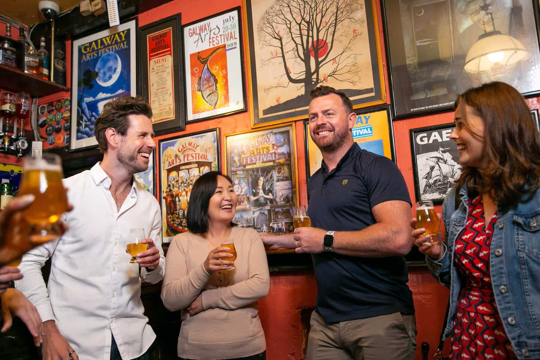 Group of friends having drinks in a pub in Galway